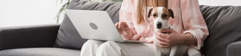 Lady and her dog writing a review.